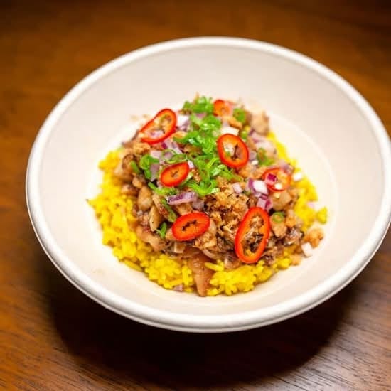 Sisig- Crisp Pork Hash with Rice.