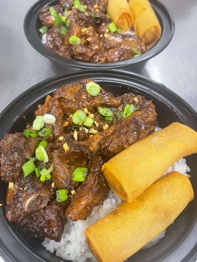 Rice Bowl 1/Pork Adobo, 2 Lumpia, Canned Soda.